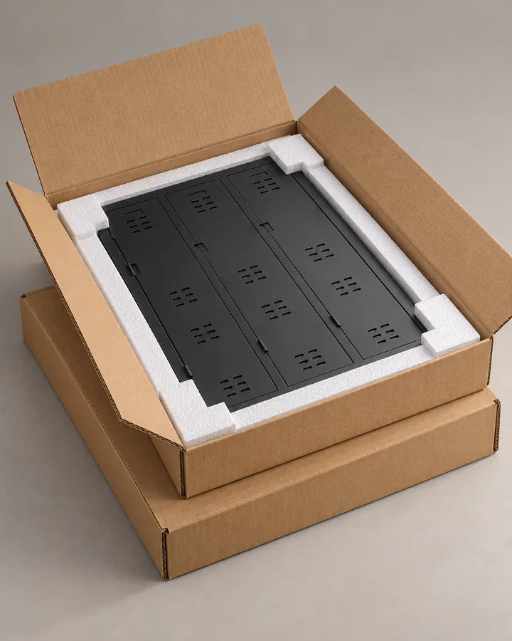Taquilla TwinThink desmontada en su caja de cartón con protecciones de espuma